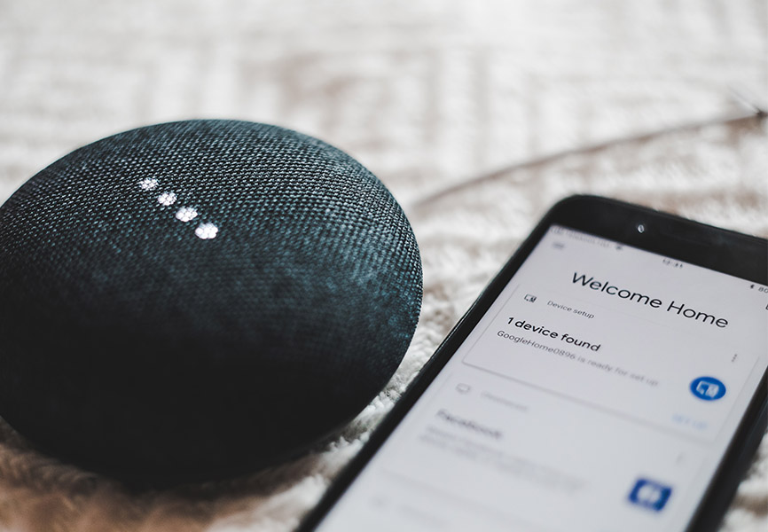 Google Home next to iPhone that says